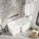 L Shaped 1500 Shower Bath with Front Panel & 4mm Fixed Screen with Rail - Right Handed