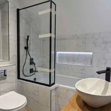 Zurich Easy Clean Matt Black Framed Bath Screen - 800mm