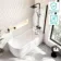 Turku 1500 Space Saving Shower Bath & 6mm Easy Clean Matt Black Bath Screen - Right Handed