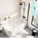 Turku 1700 Space Saving Shower Bath & 6mm Easy Clean Matt Black Bath Screen - Right Handed