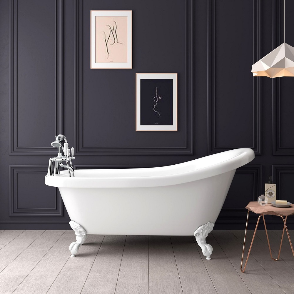 Navy blue bathroom scheme with traditional white bath tub with white ball feet and prints on the wall.