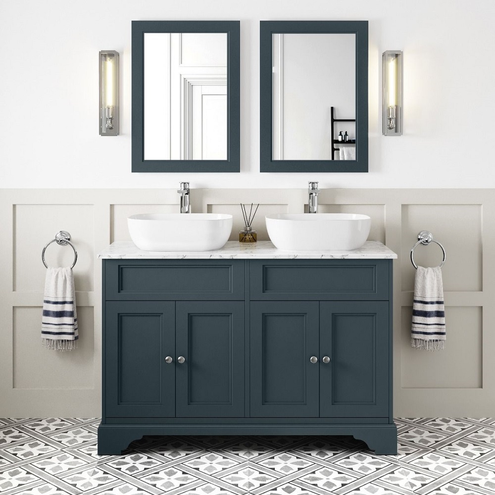 Traditional blue bathroom double vanity unit with marble top and rounded rectangular white counter top basins.