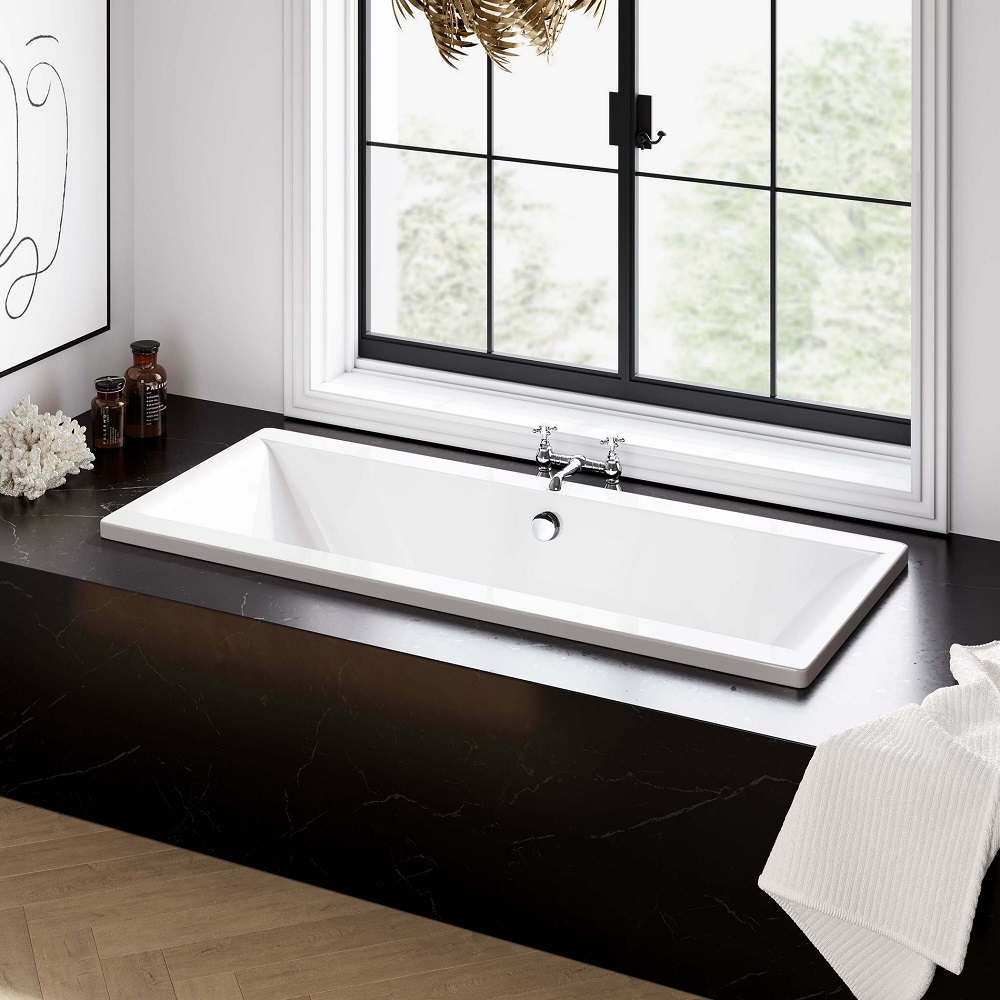 Sophisticated bathroom design showcasing a large double ended bath with classic chrome taps, nestled on a luxurious black marble countertop, with a window view and natural lighting. 